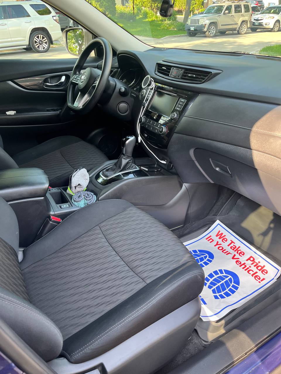 The same Rogue interior after cleaning, dash and centre console wiped down and a protective paper mat on the passenger side